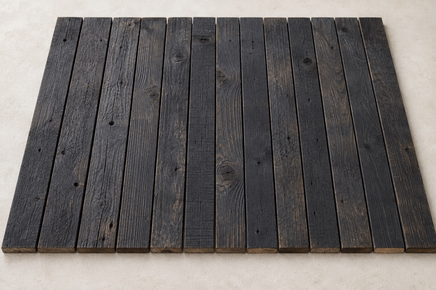 Charred timber boards with a deep black burnt surface and cracked alligator-skin texture