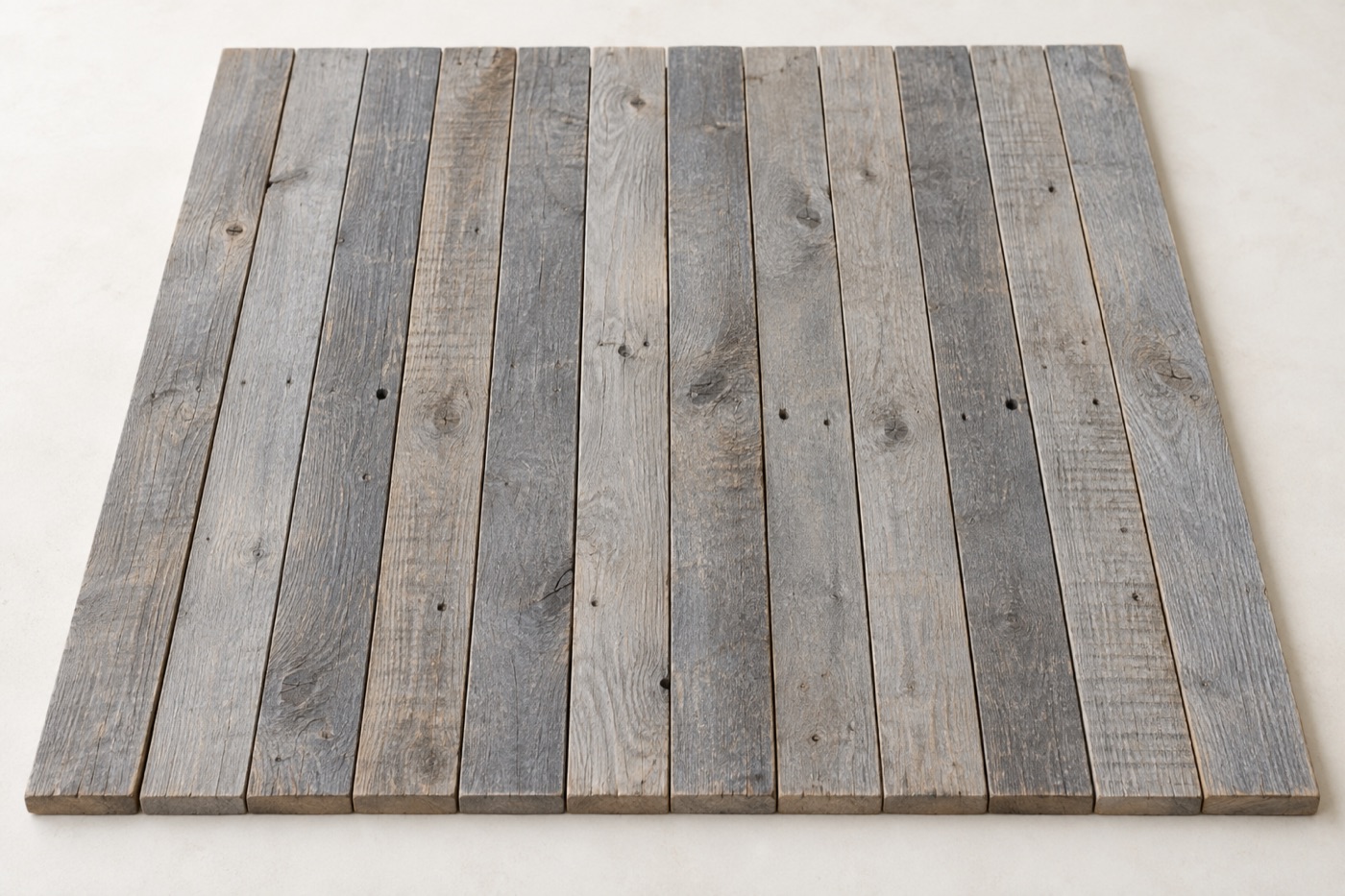 Greywashed reclaimed boards with a soft translucent grey stain and visible wood grain